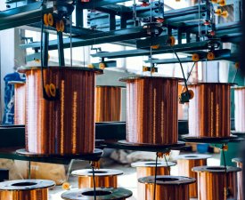 Production of copper wire, cable in reels at factory. Cable factory. Close up.